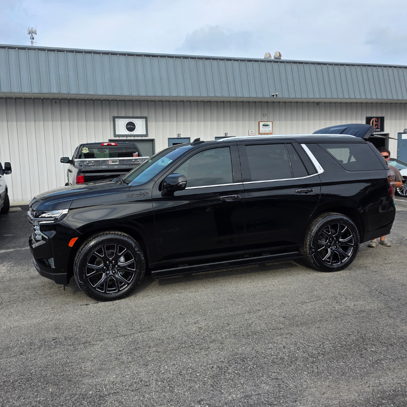 Freshly detailed black Chevy Tahoe outside our Wilmington shop