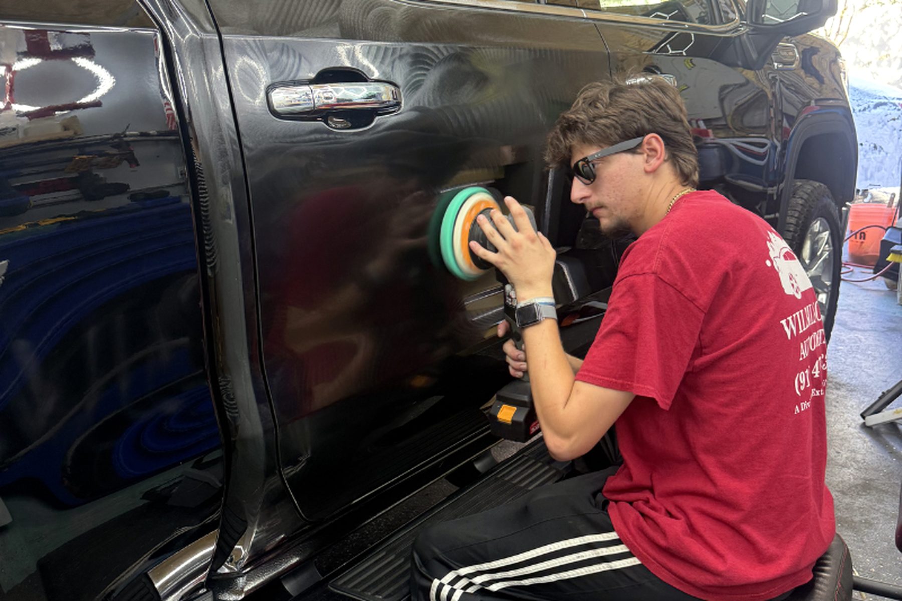 Paint correction polishing a dark finish to a mirror shine
